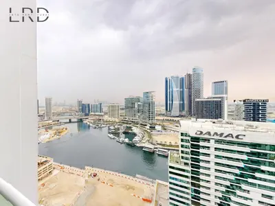 a view of a river in a city with buildings at Elegant 1BR with Stunning Canal Views in Dubai