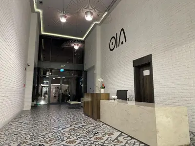 a lobby of a building with a reception desk at Elite Business & Family Turnkey 433 Residence 2BR in OIA Motor City in Dubai