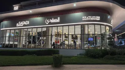 a large building with a lot of glass windows at Elite Business & Family Turnkey 433 Residence 2BR in OIA Motor City in Dubai