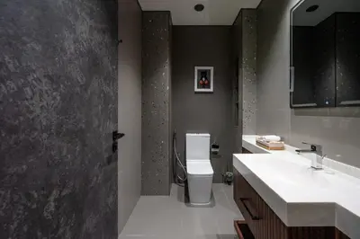 a bathroom with a toilet and a sink at MBL Royal Luxury 1BR on High Floor in Dubai