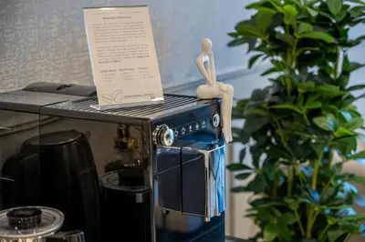 a figurine of a person sitting on top of a stove at 2BR Boutique Apartments at Burj Royale - Burj Khalifa & Dubai Mall in Dubai