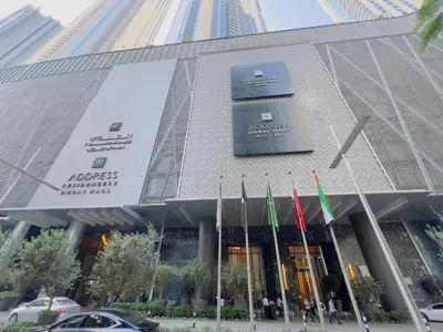 a building with flags in front of it at D Stays holiday homes 1min walk to Dubai mall & Burj Khalifa in Dubai