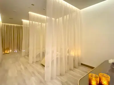 a room with white curtains on the wall at Exclusive 1BR with Iconic Views in Paramount Tower in Dubai