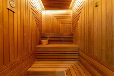 a wooden sauna with a bench in the middle at High-Rise Studio Overlooking the Sea with a Glimpse of Ain Dubai, The Palm Tower, Palm Jumeirah by Deluxe Holiday Homes in Dubai