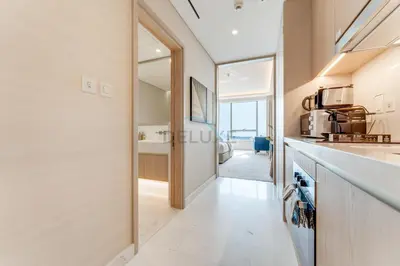 a kitchen with a sink and a counter top at High-Rise Studio Overlooking the Sea with a Glimpse of Ain Dubai, The Palm Tower, Palm Jumeirah by Deluxe Holiday Homes in Dubai