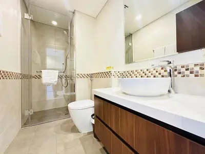 a bathroom with a sink and a toilet and a shower at AWS Holiday Homes - Top Retreat near the Burj in Dubai