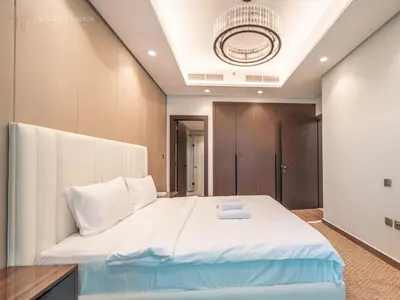 a bedroom with a large white bed in a room at Modern 1-Bed Apartment in a Prime Central Location in Dubai