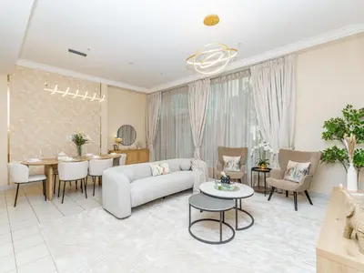 a living room with a couch and a table at Exclusive 2BR in Al Yass Tower Dubai Marina - Private Terrace & Premium Community, Managed by Think Realty in Dubai
