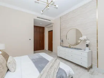 a bedroom with a white bed and a mirror at Exclusive 2BR in Al Yass Tower Dubai Marina - Private Terrace & Premium Community, Managed by Think Realty in Dubai