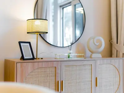 a mirror on top of a dresser with a lamp at Exclusive 2BR in Al Yass Tower Dubai Marina - Private Terrace & Premium Community, Managed by Think Realty in Dubai