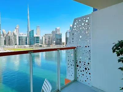 a balcony with a view of a city skyline at Luxury Oasis - Burj Khalifa Views in Dubai