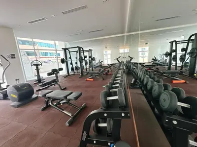 a gym with a bunch of treadmills and machines at Luxury Oasis - Burj Khalifa Views in Dubai