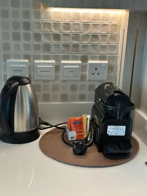 a toaster sitting on top of a kitchen counter at Seven Palm west beach Studio in Dubai