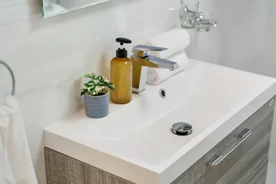 a bathroom sink with a yellow soap dispenser on it at High Floor Upgraded 2BR in JLT - Walk to Lake Park in Dubai