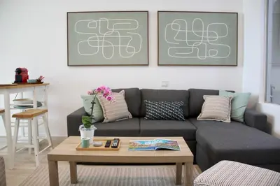 a living room with a couch and a coffee table at Upgraded & Cozy Boutique Studio in Palm Jumeirah PV7 in Dubai