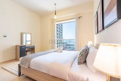 a bedroom with a bed and a large window at Sea-Facing 1BR with Ain Dubai View Close to Marina Beach, Rimal 3, Jumeirah Beach Residence by Deluxe Holiday Homes in Dubai