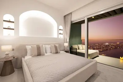 a white bedroom with a bed and a large window at Luxe 4BR with Panoramic Views l Marina & Burj in Dubai