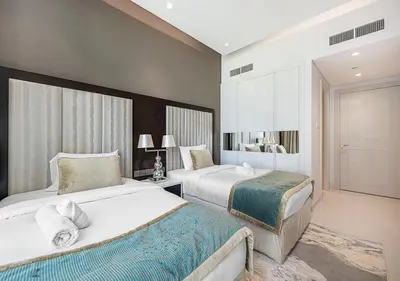 a hotel room with two beds in a room at Nice 2 Bedroom Apartment! 5 Minute walk to Dubai Mall! Burj Khalifa View! in Dubai