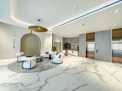 a large living room with a marble floor at Stylish Studio Retreat Modern Stay in JVC in Dubai