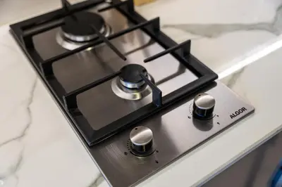 a stove top oven sitting on top of a counter at Modern Meydan Studio Burj View Downtown in Dubai