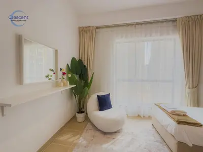 a white room with a chair and a window at Relaxing Beach Escape in JBR in Dubai