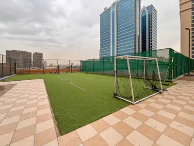 a soccer field with a goal on the roof of a building at Frank Porter - Lago Vista in Dubai