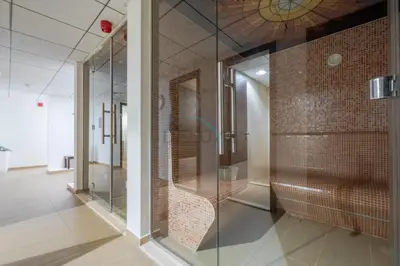 a glass walk in shower in a room at City-Centered 1BR, Minutes to Metro and Key Attractions, Sky Gardens, DIFC by Deluxe Holiday Homes in Dubai