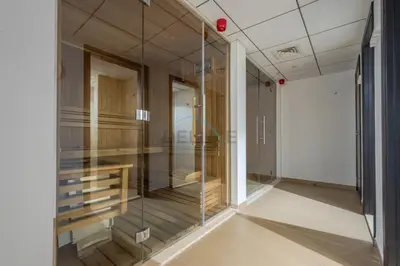 a room with glass walls and a staircase in a building at City-Centered 1BR, Minutes to Metro and Key Attractions, Sky Gardens, DIFC by Deluxe Holiday Homes in Dubai