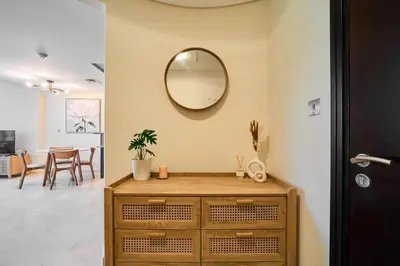 a room with a dresser and a mirror on the wall at Chic Studio in Sky Gardens, DIFC Prime Location in Dubai