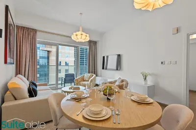 a dining room with a table and chairs at Exquisite 1 Bedroom Sea View with Lavish Amenities in Dubai