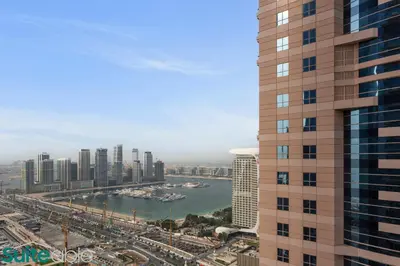 a view of a city with a river and buildings at Exquisite 1 Bedroom Sea View with Lavish Amenities in Dubai