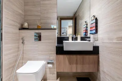 a bathroom with a white sink and a toilet at Missoni Luxury Life Suite DPA Direct Pool Access in Dubai