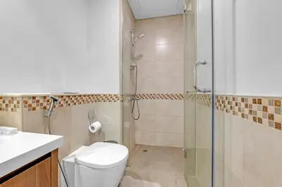 a bathroom with a shower and a toilet at City View 1BR Prime Location in Business Bay by Vibel in Dubai