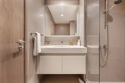 a bathroom with a sink and a shower at ALiving Elite 3BR Apartment I Burj Khalifa & Fountain View I Burj Royale in Dubai