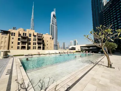a swimming pool in the middle of a city at ALiving Elite 3BR Apartment I Burj Khalifa & Fountain View I Burj Royale in Dubai