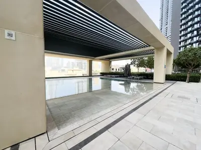 a swimming pool in a building with a building at ALiving Elite 3BR Apartment I Burj Khalifa & Fountain View I Burj Royale in Dubai