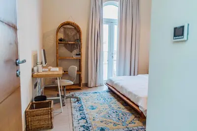 a bedroom with a bed and a desk with a computer at Stunning 4BR Jumeira Park Villa With Pool and Jacuzzi in Dubai
