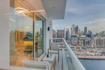 a balcony with a view of a city at Burj Khalifa & Canal Views at Mayfair Tower in business bay - Luxurious 1BDR Apartment in Dubai