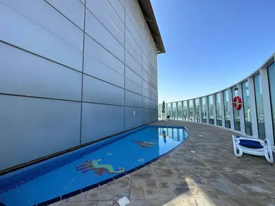 a swimming pool on the side of a building at Silkhaus Cozy Studio at Madison in Barsha Heights in Dubai