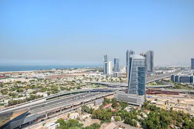 an aerial view of a city with a highway at Silkhaus Large Studio in Madison near Barsha Heights in Dubai