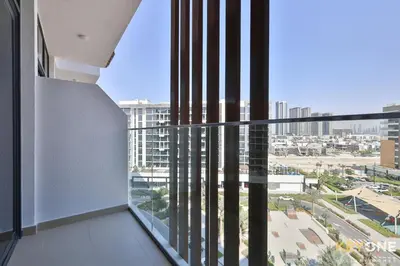 an apartment balcony with a view of a city at Modern Elegance Studio in Azizi Riviera in Dubai