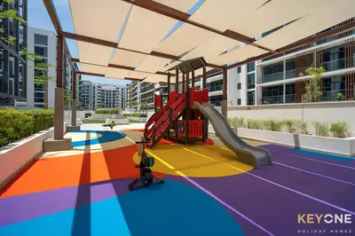 a playground with a slide in a building at Modern Elegance Studio in Azizi Riviera in Dubai