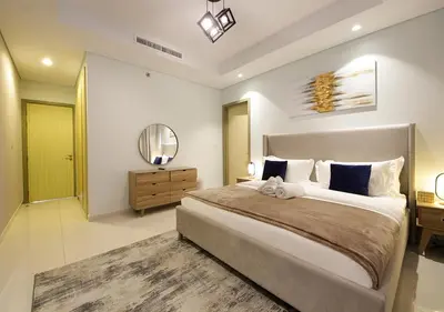 a bedroom with a large bed and a mirror at Opulent 2BR In Paramount Hotel Apt in Dubai