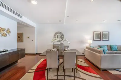 a living room with a table and a couch at RH -Luxury Living, Full Sea View Apartment on palm in Dubai
