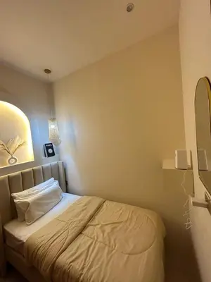 a bedroom with a bed in a room at Adaz Home in Dubai