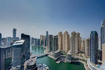 a view of a city with a river and buildings at Luxurious Apartment And Amazing Dubai Marina View in Dubai
