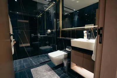 a bathroom with a toilet and a sink and a shower at Luxury 2 bedroom Unit, Prime Location in Dubai