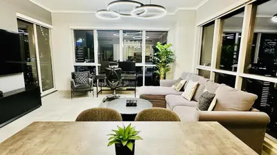 a living room with a couch and a table at Luxury in the Sky - 1BR Burj Inner Circle in Dubai