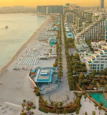an aerial view of a beach with buildings and the water at Elegant 1-BR with Sea View Seven Palm, Palm Jumeirah in Dubai