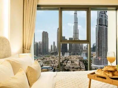 a hotel room with a view of a city at Burj Royale Suites by Prestige Nest in Dubai